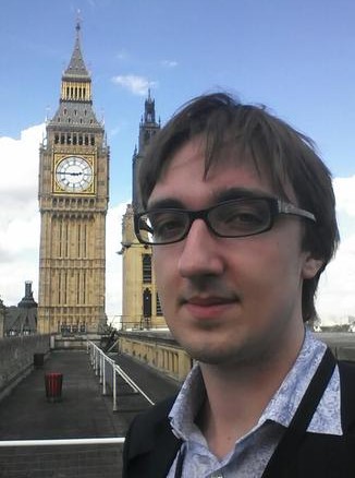 Asa Bennett in front of Big Ben from the roof