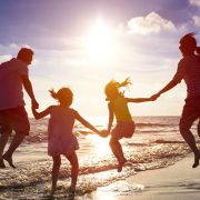 family travelling on a beach