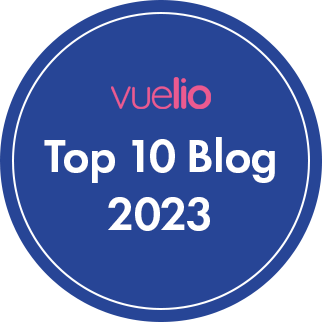 Blue circular badge graphic with text overlaid that reads Vuelio Top 10 Blog 2023