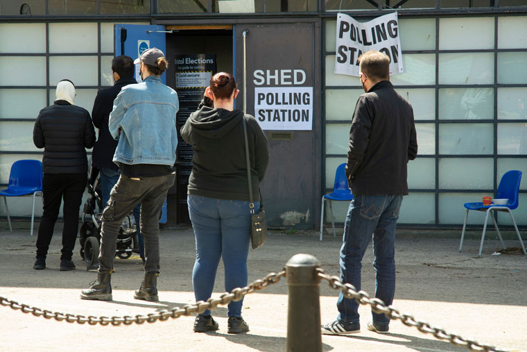 voters queuing outside polling station